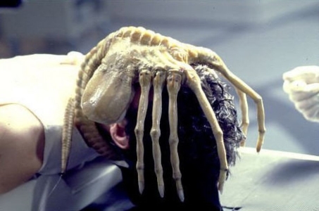 In 'Alien', who was brought back with a face-hugger on his face?