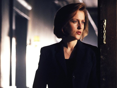 Scully has a tattoo of what symbol?